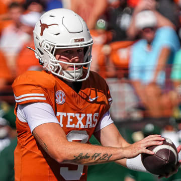 Texas Longhorns quarterback Quinn Ewers (3) snaps the ball during the game against Colorado State at Darrell K Royal-Texas Memorial Stadium in Austin Saturday, Aug. 31, 2024.