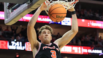 Dec 21, 2024; Newark, New Jersey, USA; Princeton Tigers forward Caden Pierce (3) dunks the ball against the Rutgers Scarlet Knights during the second half at Prudential Center.