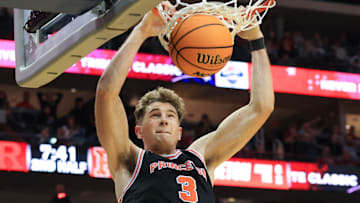 Dec 21, 2024; Newark, New Jersey, USA; Princeton Tigers forward Caden Pierce (3) dunks the ball against the Rutgers Scarlet Knights during the second half at Prudential Center.