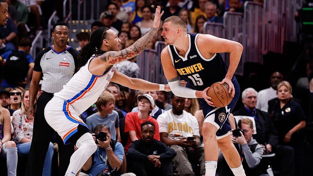 May 11, 2025; Denver, Colorado, USA; Denver Nuggets center Nikola Jokic (15) controls the ball under pressure from Oklahoma City Thunder forward Jaylin Williams (6) in the second quarter during game four of the second round of the 2025 NBA Playoffs at Ball Arena. Mandatory Credit: Isaiah J. Downing-Imagn Images