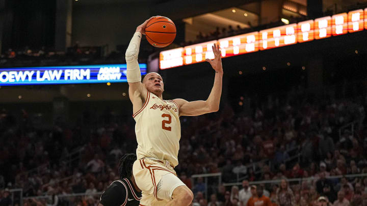 Texas Longhorns guard Chendall Weaver (2) dunks the ball during the basketball game against Oklahoma State at the Moody Center on Saturday, Mar. 2, 2024 in Austin.