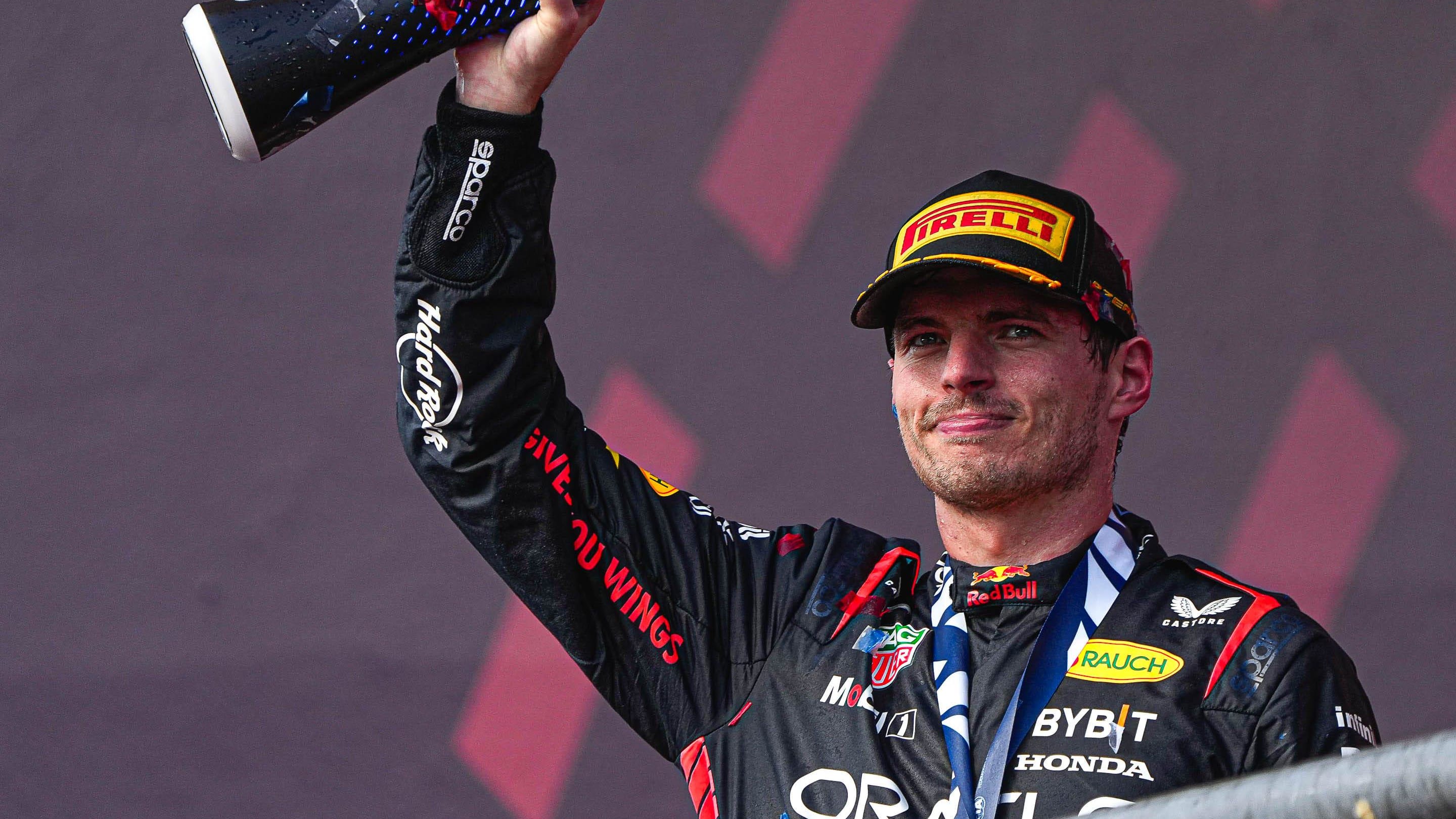 Oracle Red Bull Racing driver Max Verstappen hoists the trophy after winning the Formula 1 Lenovo