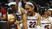 Apr 2, 2017; Dallas, TX, USA; South Carolina Gamecocks forward A'ja Wilson (22) and guard Tiffany Davis (15) and guard Allisha Gray (10) celebrate on the podium after defeating the Mississippi State Lady Bulldogs in the 2017 Women's Final Four championship at American Airlines Center. Mandatory Credit: Matthew Emmons-Imagn Images