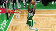 Jun 17, 2024; Boston, Massachusetts, USA; Boston Celtics guard Jaylen Brown (7) dunks against the Dallas Mavericks during the first half in game five of the 2024 NBA Finals at TD Garden. Mandatory Credit: Peter Casey-Imagn Images