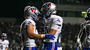 Westlake's Cal Livengood (10) celebrates a TD with running back Grady Bartlett (36) against Steele on Friday night.