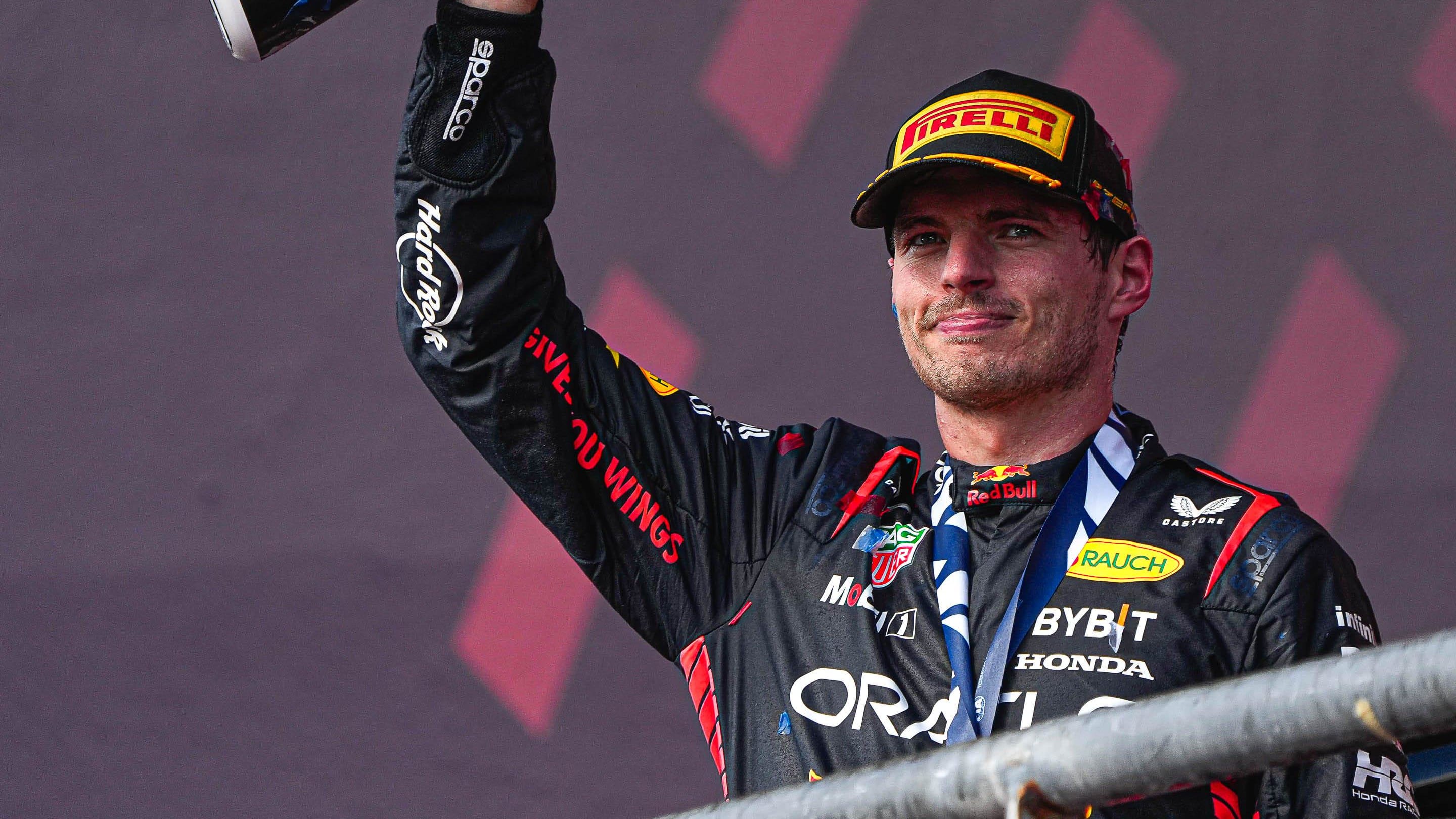 Oracle Red Bull Racing driver Max Verstappen hoists the trophy after winning the Formula 1 Lenovo