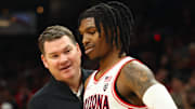 Dec 20, 2023; Phoenix, Arizona, USA; Arizona Wildcats head coach Tommy Lloyd with guard Caleb Love (2) against the Alabama Crimson Tide in the Hall of Fame Series at Footprint Center