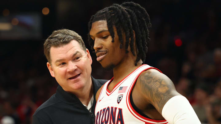 Dec 20, 2023; Phoenix, Arizona, USA; Arizona Wildcats head coach Tommy Lloyd with guard Caleb Love (2) against the Alabama Crimson Tide in the Hall of Fame Series at Footprint Center Dec 20, 2023; Phoenix, Arizona, USA; Arizona Wildcats head coach Tommy Lloyd with guard Caleb Love (2) against the Alabama Crimson Tide in the Hall of Fame Series at Footprint Center