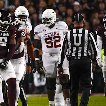 Nov 30, 2024; College Station, Texas, USA; Texas A&M defensive lineman Cashius Howell (18) celebrates a defensive stop during the Lone Star Showdown against the Texas Longhorns at Kyle Field. Mandatory Credit: Sara Diggins/USA TODAY Network via Imagn Images