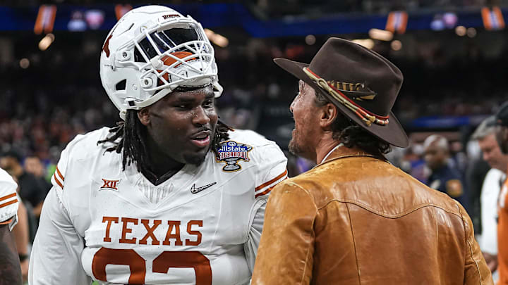 Actor Matthew McConaughey talks to Texas Longhorns defensive lineman T'Vondre Sweat (93) ahead of the Sugar Bowl College Football Playoff  semifinals game against the Washington Huskies at the Caesars Superdome on Monday, Jan. 1, 2024 in New Orleans, Louisiana.