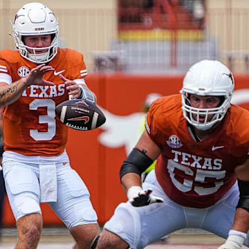 Texas Longhorns quarterback Quinn Ewers (3) snaps the ball during the game against Colorado State at Darrell K Royal-Texas Memorial Stadium in Austin Saturday, Aug. 31, 2024.