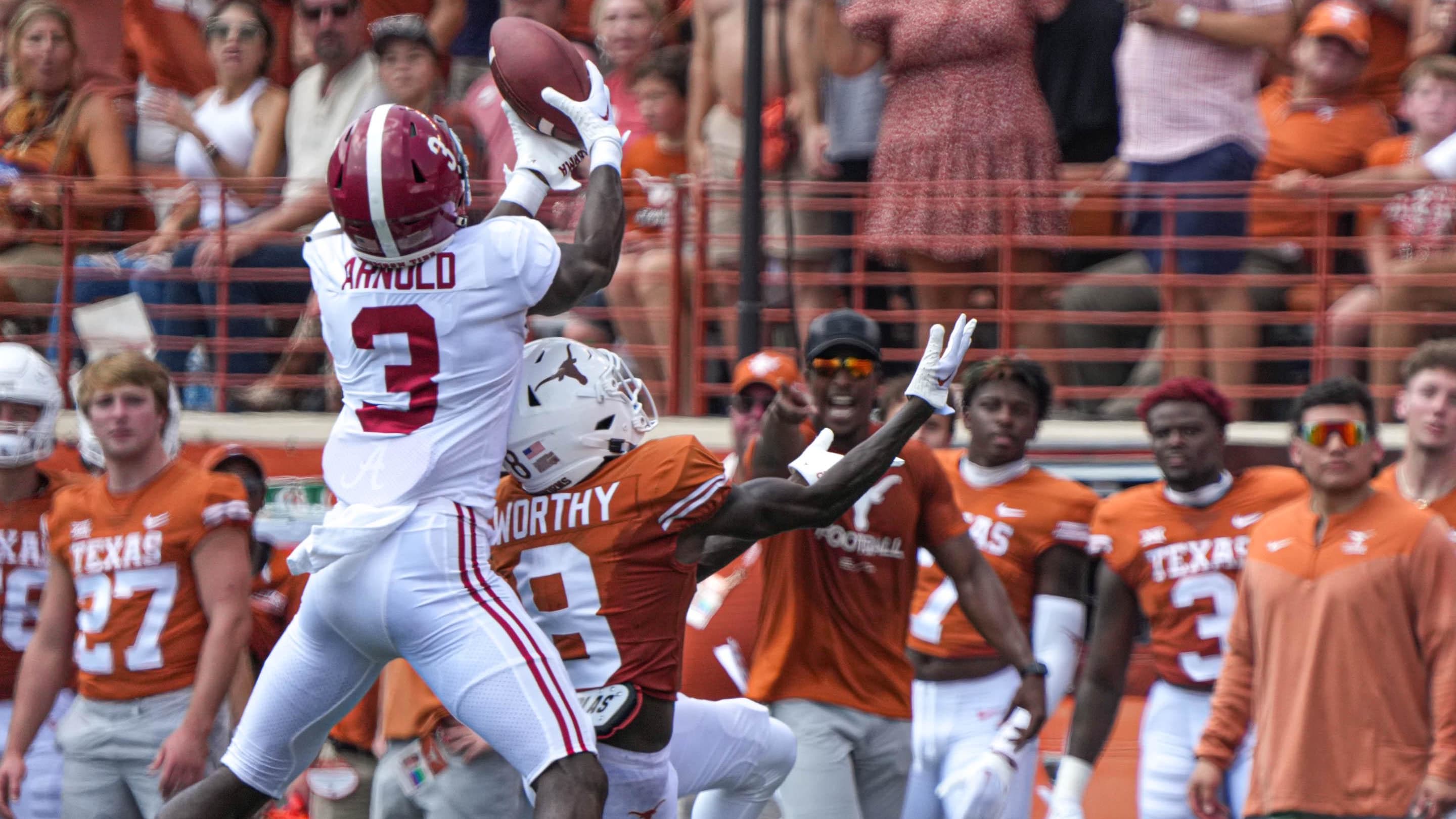 Alabama defensive back Terrion Arnold (3) jumps to intercept a pass against the Texas Longhorns.