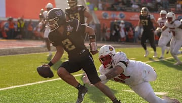 Washington’s Demond Williams Jr. (2) runs the ball during the 91st Tony the Tiger Sun Bowl game against Louisville on Tuesday, Dec. 31, 2024 at the Sun Bowl Stadium in El Paso, Texas.