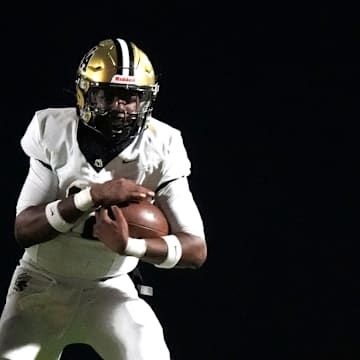 Oct 31, 2025; Graniteville, South Carolina, USA; North Augusta wide receiver Isaiah Smith (1) runs the ball during the Midland Valley and North Augusta high school football game at Midland Valley High School. North Augusta won 42-29.