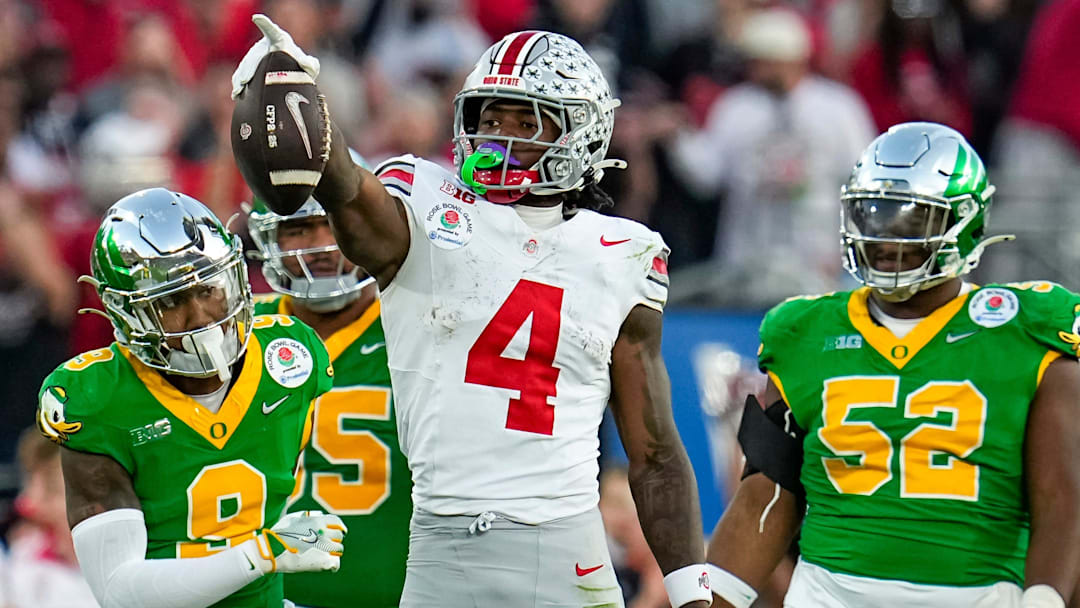 Ohio State wide receiver Jeremiah Smith (4) celebrates a first-down catch against Oregon during the 2025 Rose Bowl in Pasadena, Calif.