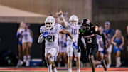 Sep 19, 2025; Stillwater, Oklahoma, USA; Tulsa Golden Hurricane running back Dominic Richardson (21) runs the ball past Oklahoma State Cowboys cornerback Cam Smith (3) during the second half at Boone Pickens Stadium. Mandatory Credit: William Purnell-Imagn Images