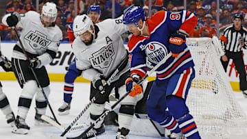 May 1, 2025; Edmonton, Alberta, CAN; Edmonton Oilers forward Corey Perry (90) battles with Los Angeles Kings defensemen Drew Doughty (8) for a loose puck during the first period in game six of the first round of the 2025 Stanley Cup Playoffs at Rogers Place. Mandatory Credit: Perry Nelson-Imagn Images