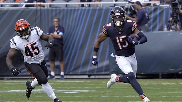 Aug 17, 2024; Chicago, Illinois, USA; Chicago Bears wide receiver Rome Odunze (15) catches a pass as Cincinnati Bengals linebacker Maema Njongmeta (45) pursues him during the first half at Soldier Field. Mandatory Credit: David Banks-Imagn Images