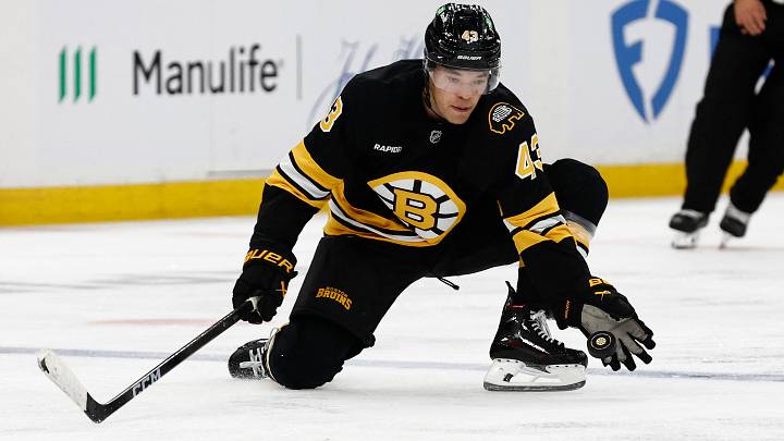 Oct 11, 2025; Boston, Massachusetts, USA; Boston Bruins defenseman Jordan Harris (43) reaches for a puck to keep it in the zone during the third period against the Buffalo Sabres at TD Garden. Mandatory Credit: Winslow Townson-Imagn Images Oct 11, 2025; Boston, Massachusetts, USA; Boston Bruins defenseman Jordan Harris (43) reaches for a puck to keep it in the zone during the third period against the Buffalo Sabres at TD Garden. Mandatory Credit: Winslow Townson-Imagn Images