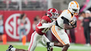 Tennessee wide receiver Mike Matthews (4) is grabbed by Alabama defensive back Red Morgan (16) during a college football game at Bryant-Denny Stadium in Tuscaloosa, Ala., on Oct. 18, 2025.