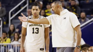 Michigan Wolverines head coach Juwan Howard talks to guard Jett Howard (13) in the first half against the Jackson State Tigers at Crisler Center. 