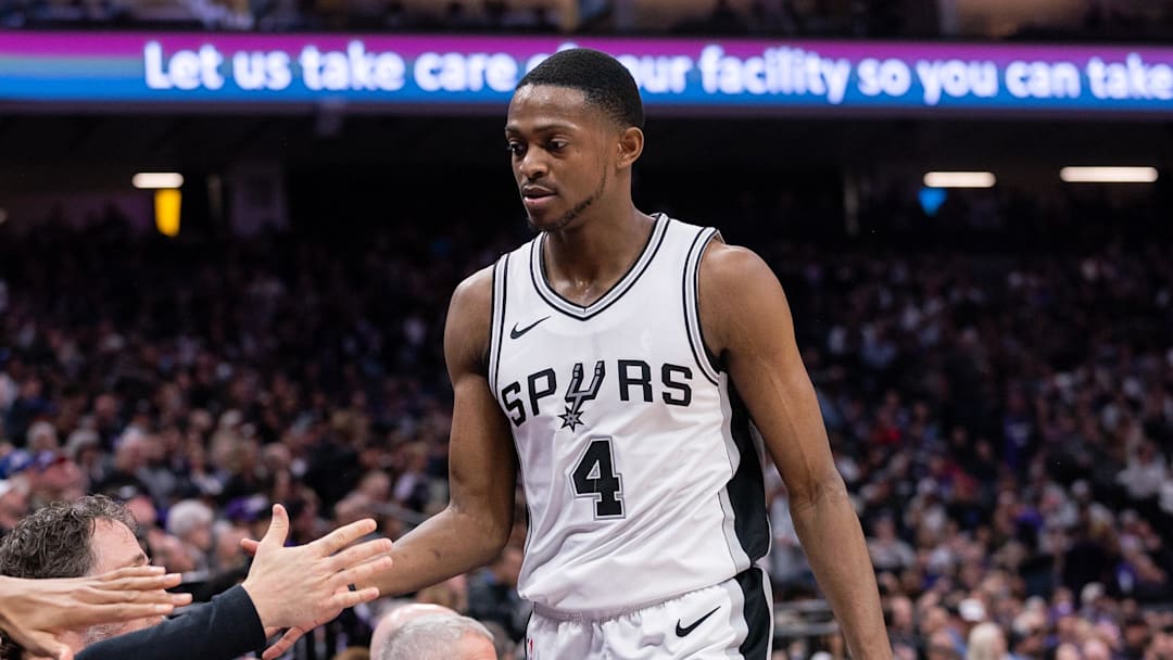 Mar 7, 2025; Sacramento, California, USA; San Antonio Spurs guard De'Aaron Fox (4) high fives team mates after coming out of the game during the fourth quarter at Golden 1 Center. Mandatory Credit: Ed Szczepanski-Imagn Images