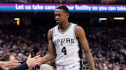 Mar 7, 2025; Sacramento, California, USA; San Antonio Spurs guard De'Aaron Fox (4) high fives team mates after coming out of the game during the fourth quarter at Golden 1 Center. Mandatory Credit: Ed Szczepanski-Imagn Images
