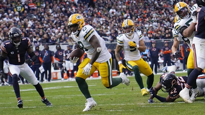 Green Bay Packers running back Josh Jacobs (8) runs for a touchdown against the Chicago Bears. Green Bay Packers running back Josh Jacobs (8) runs for a touchdown against the Chicago Bears.