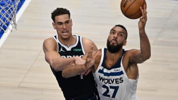 May 28, 2024; Dallas, Texas, USA; Minnesota Timberwolves center Rudy Gobert (27) collects an offensive rebound over Dallas Mavericks center Dwight Powell (7) during the first quarter of game four of the western conference finals for the 2024 NBA playoffs at American Airlines Center. Mandatory Credit: Jerome Miron-USA TODAY Sports