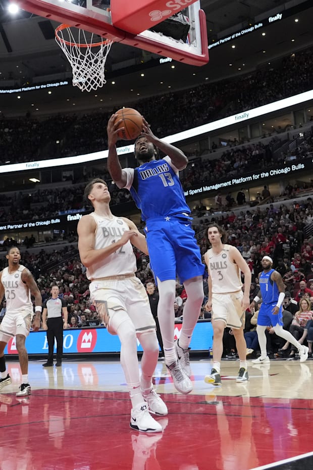 Chicago Bulls forward Zach Collins defends Dallas Mavericks forward Naji Marshall