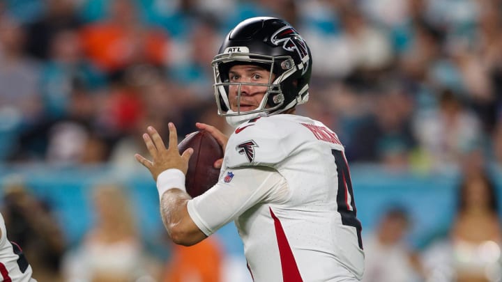 Aug 9, 2024; Miami Gardens, Florida, USA; Atlanta Falcons quarterback Taylor Heinicke (4) drops back to pass against the Miami Dolphins in the second quarter during preseason at Hard Rock Stadium. Mandatory Credit: Nathan Ray Seebeck-USA TODAY Sports