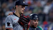 Jul 30, 2024; New York City, New York, USA; Minnesota Twins catcher Christian Vazquez (8) puts his arm around starting pitcher David Festa (58) was they walk back to the dugout after the fifth inning against the New York Mets at Citi Field. Mandatory Credit: Brad Penner-USA TODAY Sports