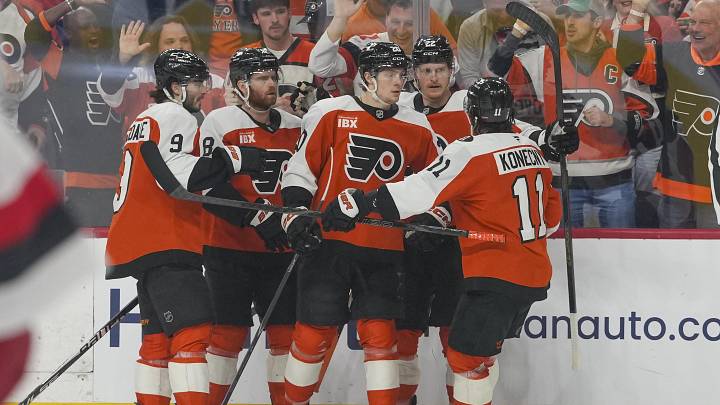May 9, 2026; Philadelphia, Pennsylvania, USA; Philadelphia Flyers left wing Alex Bump (20) celebrates a goal teammates against the Carolina Hurricanes in game four of the second round of the 2026 Stanely Cup Playoffs at Xfinity Mobile Arena.