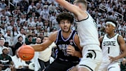 Dec 6, 2025; East Lansing, Michigan, USA;  Duke Blue Devils forward Cameron Boozer (12) advances against Michigan State Spartans center Carson Cooper (15) during the first half at Jack Breslin Student Events Center. Mandatory Credit: Dale Young-Imagn Images