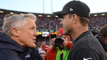 December 8, 2013; San Francisco, CA, USA; Seattle Seahawks head coach Pete Carroll (left) shakes hands with San Francisco 49ers head coach Jim Harbaugh (right) after the game.