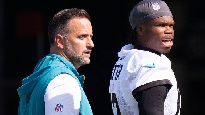 Jacksonville Jaguars Defensive Coordinator Anthony Campanile, left, walks off the field with Jacksonville Jaguars wide receiver Travis Hunter (12) after the Jacksonville Jaguars’ 18th and final training camp practice at Miller Electric Center in Jacksonville, Fla. Wednesday August 20, 2025. 
