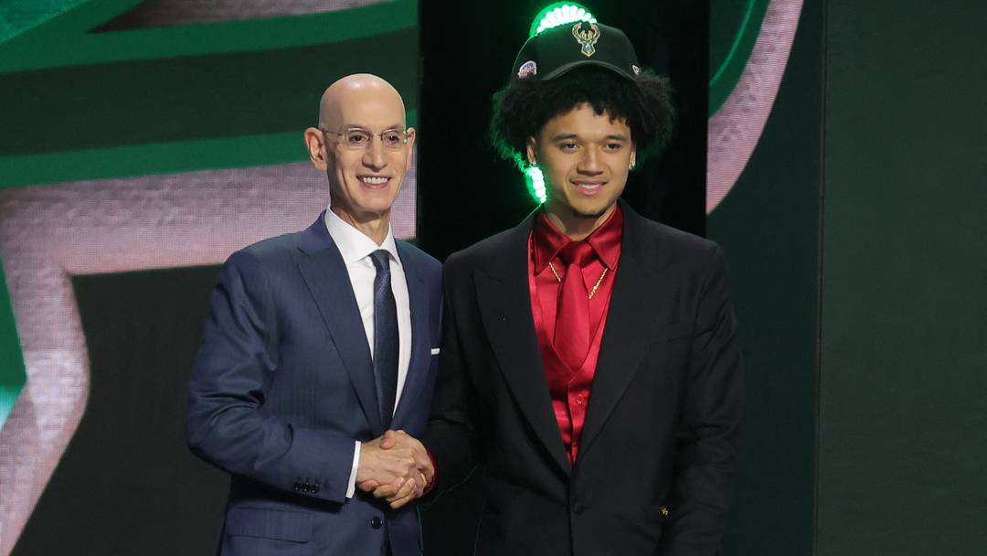Jun 23, 2026; New York, NY, USA; NBA commissioner Adam Silver greets the tenth pick in the 2026 NBA draft, Arizona guard Brayden Burries after he was selected by the Milwaukee Bucks at Barclays Center. Mandatory Credit: Brad Penner-Imagn Images