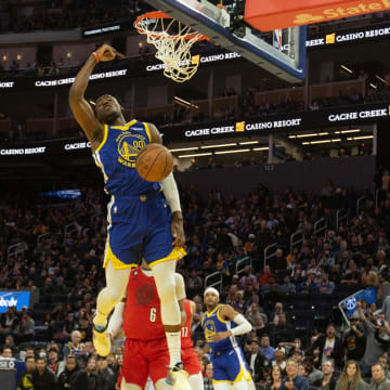 Feb 28, 2023; San Francisco, California, USA; Golden State Warriors forward Jonathan Kuminga (00) dunks against the Portland Trail Blazers during the fourth quarter at Chase Center. 