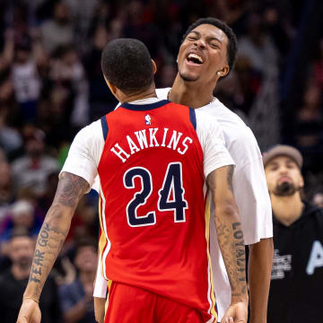 Nov 18, 2023; New Orleans, Louisiana, USA; New Orleans Pelicans guard Jordan Hawkins (24) and guard Trey Murphy III (25) chest bump after making a three point basket against the Minnesota Timberwolves during the second half at the Smoothie King Center. Mandatory Credit: Stephen Lew-USA TODAY Sports