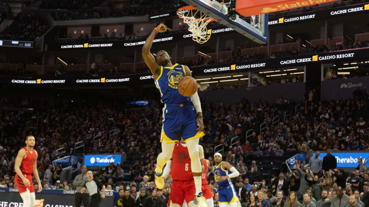 Feb 28, 2023; San Francisco, California, USA; Golden State Warriors forward Jonathan Kuminga (00) dunks against the Portland Trail Blazers during the fourth quarter at Chase Center. 