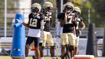 Aug 1, 2023; Metairie, LA, USA;  New Orleans Saints wide receiver Chris Olave (12) and wide receiver A.T. Perry (17) dance during  training camp at the Ochsner Sports Performance Center. Mandatory Credit: Stephen Lew-USA TODAY Sports