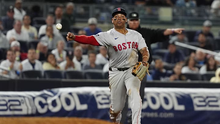 Sep 12, 2024; Bronx, New York, USA; Boston Red Sox third baseman Rafael Devers (11) throws out New York Yankees shortstop Anthony Volpe (not pictured) after fielding a ground ball during the ninth inning at Yankee Stadium. Mandatory Credit: Gregory Fisher-Imagn Images