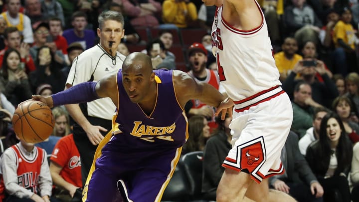 Feb 21, 2016; Chicago, IL, USA; Los Angeles Lakers forward Kobe Bryant (24) drives to the basket against Chicago Bulls guard Mike Dunleavy (34) during the second half at United Center. Mandatory Credit: Kamil Krzaczynski-USA TODAY Sports