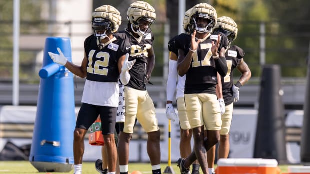 New Orleans Saints wide receivers Chris Olave (12) and A.T. Perry (17) during a training camp practice 