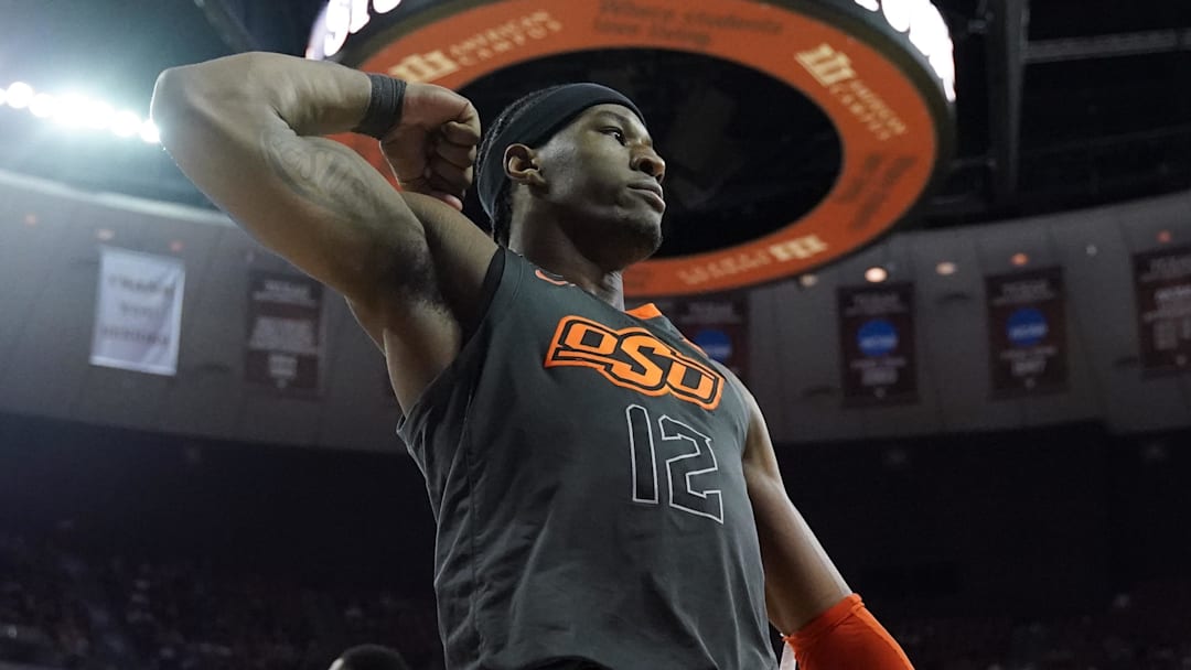 Mar 7, 2020; Austin, Texas, USA; Oklahoma State Cowboys forward Cameron McGriff (12) flexes his bicep after drawing a foul after scoring in the second half of the game against the Texas Longhorns at Frank C. Erwin Jr. Center. Mandatory Credit: Scott Wachter-Imagn Images