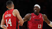 Dec 7, 2024; Miami, Florida, USA;  Miami Heat center Bam Adebayo (13) celebrates with guard Tyler Herro (14) after Herro made a three-point basket against the Phoenix Suns during the second half at Kaseya Center. Mandatory Credit: Jim Rassol-Imagn Images