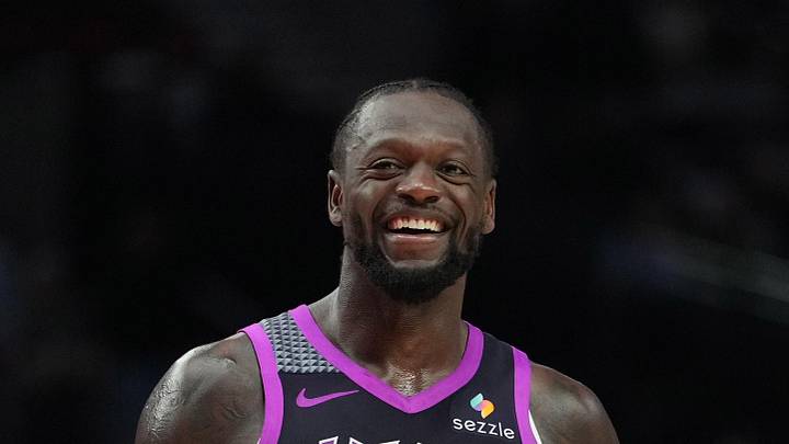 Feb 24, 2026; Portland, Oregon, USA; Minnesota Timberwolves forward Julius Randle (30) and Portland Trail Blazers guard Jrue Holiday (5) share a laugh during the second half at Moda Center. Mandatory Credit: Soobum Im-Imagn Images