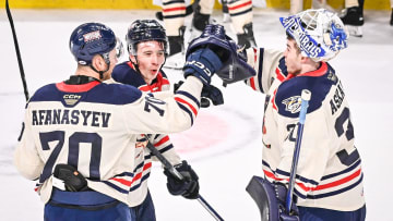 Milwaukee Admirals goaltender Yaroslav Askarov celebrates with left wing Egor Afanasyev and center Fedor Svechkov after a 5-0 victory over the Colorado Eagles on Saturday, January 6, 2024, at UW-Milwaukee Panther Arena in Milwaukee, Wisconsin.