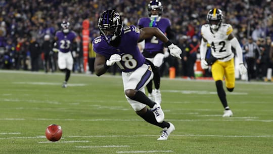 Jan 11, 2025; Baltimore, Maryland, USA; Baltimore Ravens wide receiver Steven Sims (18) muffs a punt return as Pittsburgh Steelers cornerback James Pierre (42) chases in an AFC wild card game at M&T Bank Stadium. Mandatory Credit: Geoff Burke-Imagn Images