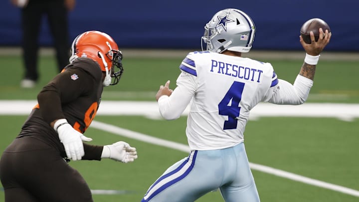 Oct 4, 2020; Arlington, Texas, USA; Dallas Cowboys quarterback Dak Prescott (4) drops back to pass against Cleveland Browns defensive end Myles Garrett (95) in the first quarter at AT&T Stadium. Mandatory Credit: Tim Heitman-Imagn Images